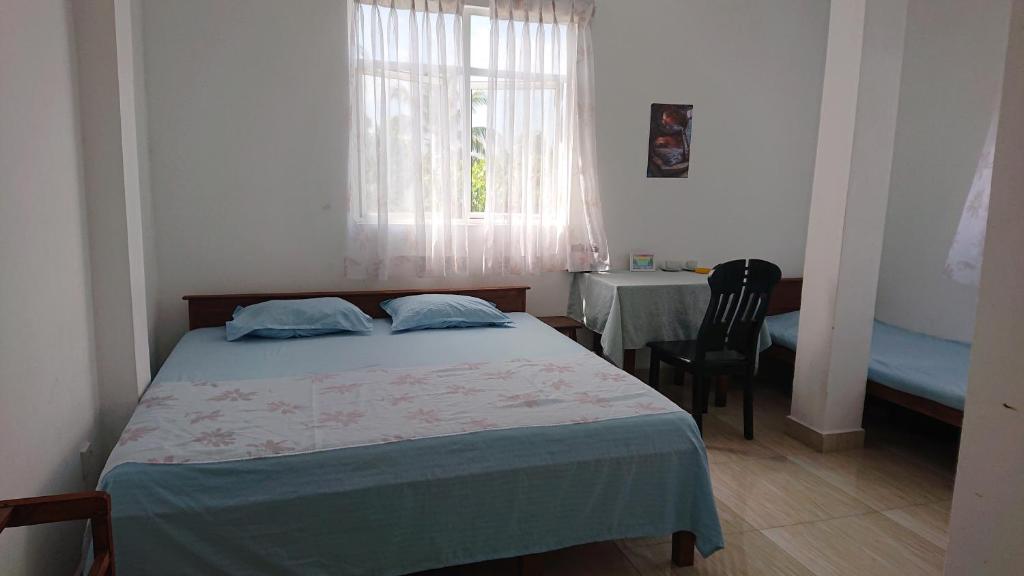 Postel nebo postele na pokoji v ubytování CANAAN MUSIC Hotel