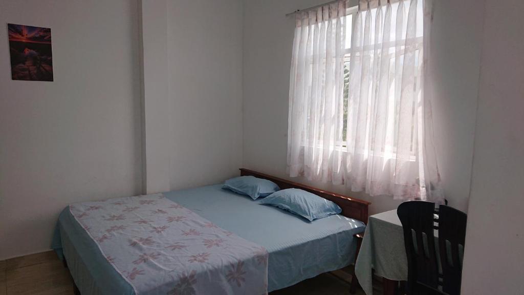 Postel nebo postele na pokoji v ubytování CANAAN MUSIC Hotel