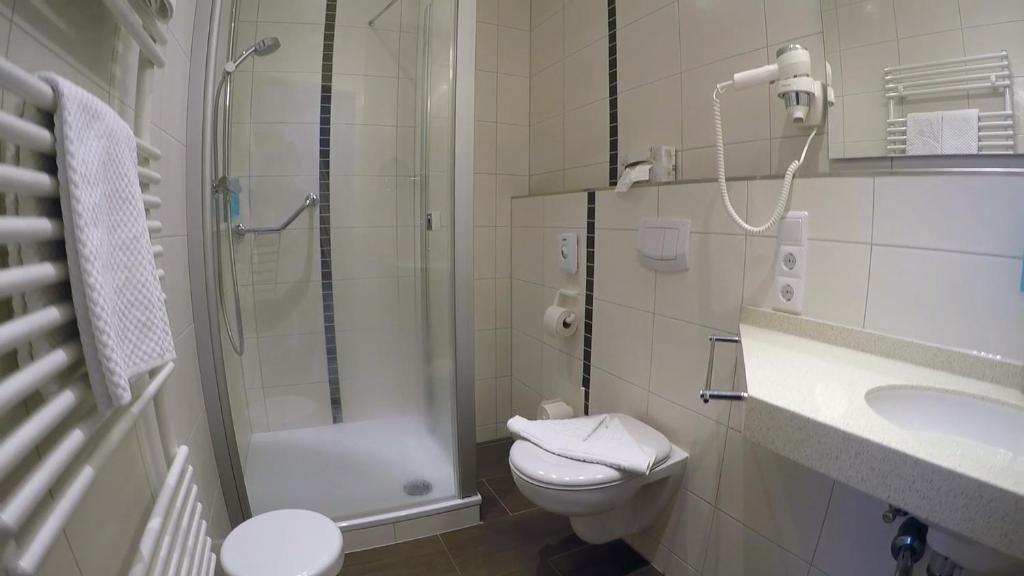Koupelna v ubytování Hotel Weisse Düne