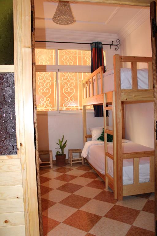 Postel nebo postele na pokoji v ubytování Natural Surf House