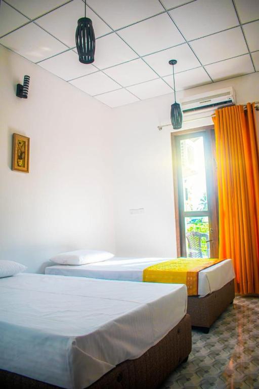 Postel nebo postele na pokoji v ubytování Thambara Resort