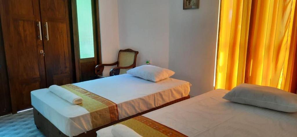 Postel nebo postele na pokoji v ubytování Thambara Resort