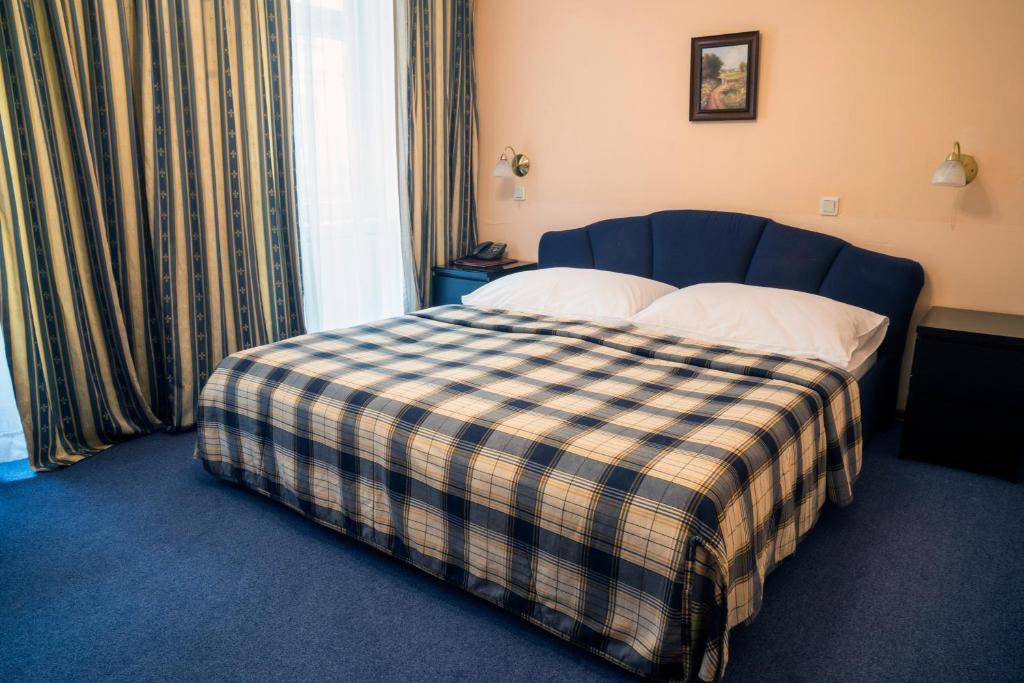 Postel nebo postele na pokoji v ubytování Hotel Bajazzo