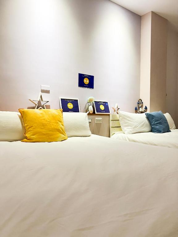 Postel nebo postele na pokoji v ubytování Zhuji Hostel