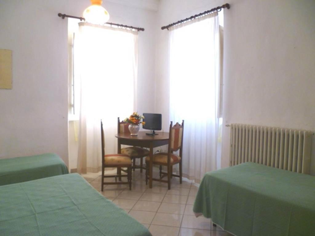 Postel nebo postele na pokoji v ubytování Albergo Ape Elbana