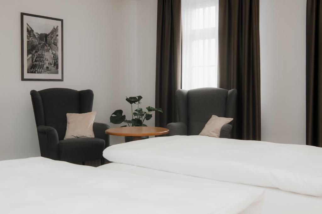 Postel nebo postele na pokoji v ubytování Hotel Alekto