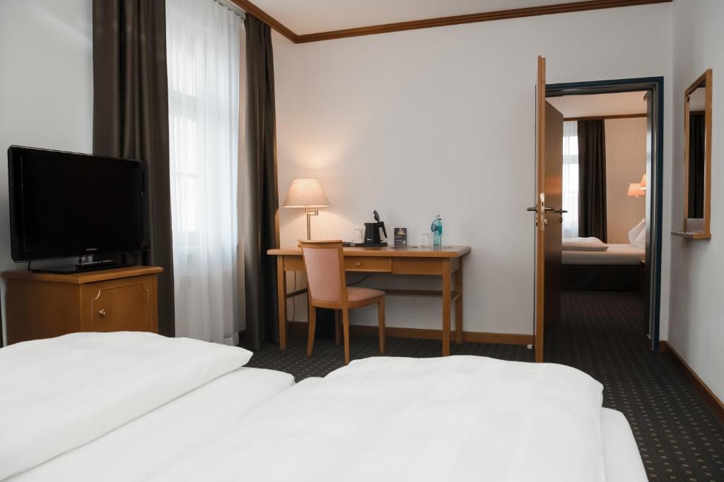 Postel nebo postele na pokoji v ubytování Hotel Alekto