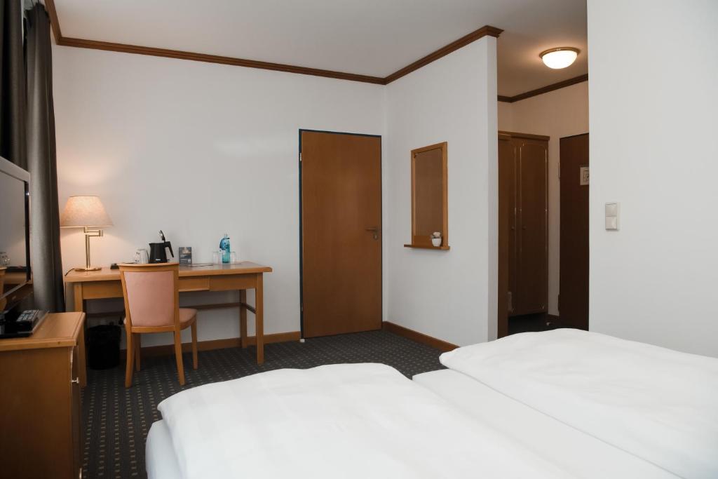 Postel nebo postele na pokoji v ubytování Hotel Alekto