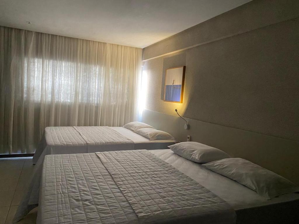 Postel nebo postele na pokoji v ubytování Loft 1 Edf celita Franca Business hotel