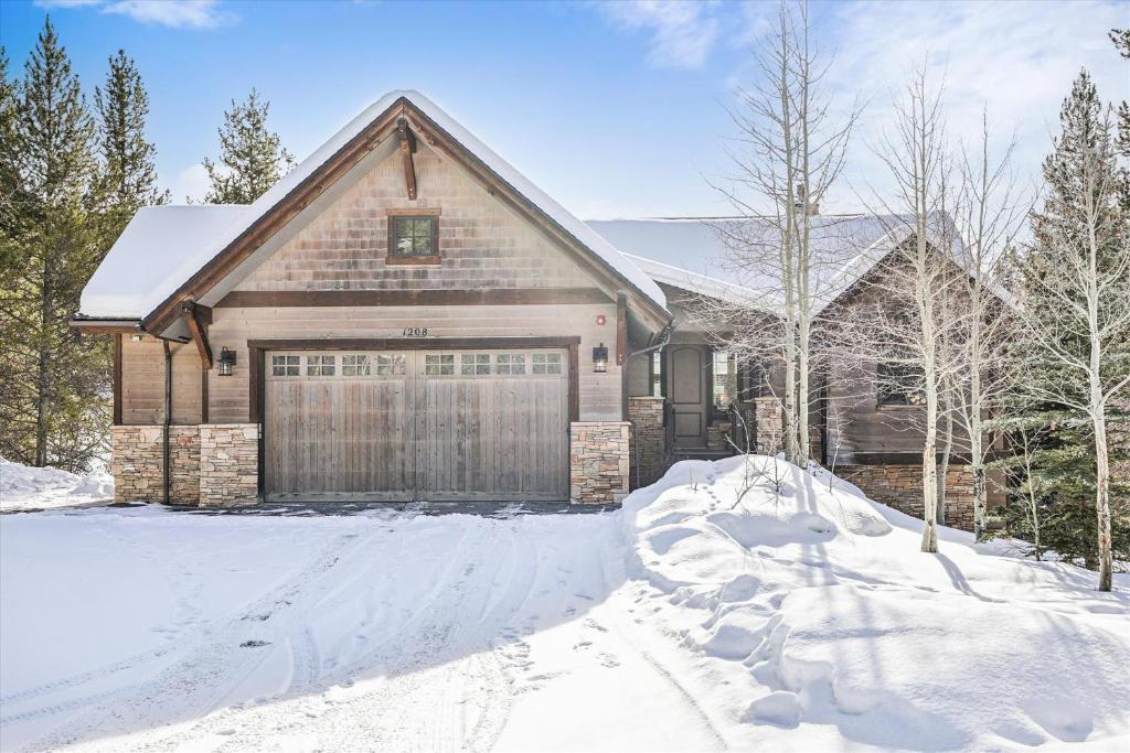 a house with a garage in the snow at The Beaver Lodge at Breckenridge home in Breckenridge