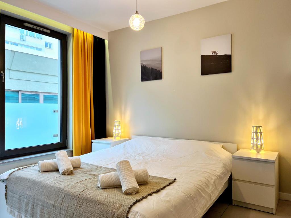 Ένα ή περισσότερα κρεβάτια σε δωμάτιο στο Port Apartamenty Szczecin - Stare Miasto