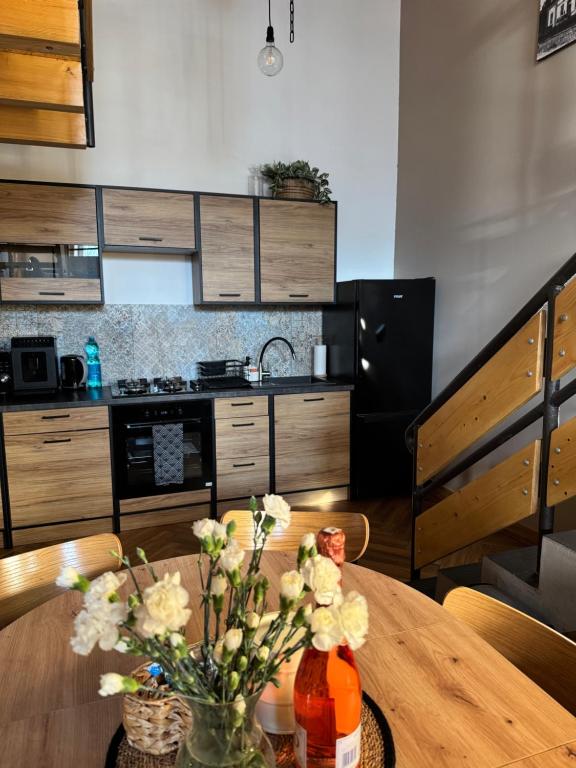 Kuchyňa alebo kuchynka v ubytovaní Dawna Mleczarnia Apartamenty LOFT