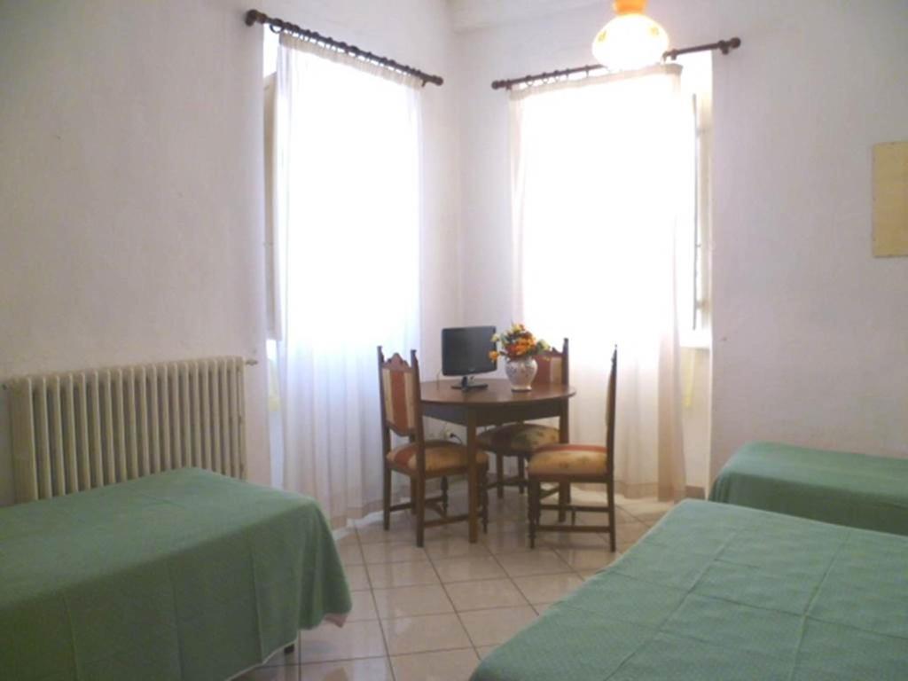 Postel nebo postele na pokoji v ubytování Albergo Ape Elbana