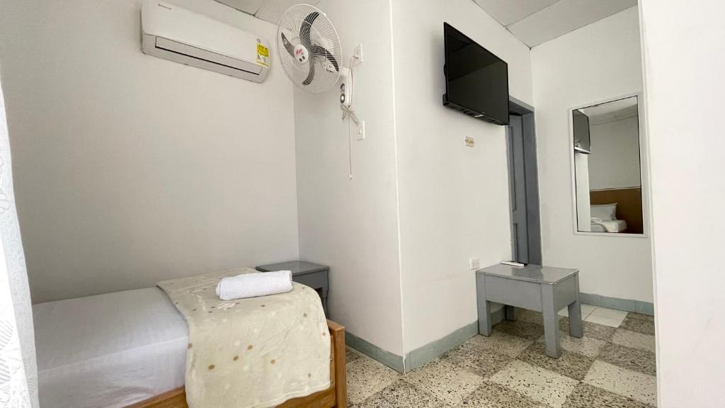 TV a/nebo společenská místnost v ubytování Hotel Balcon de Oro Curumani