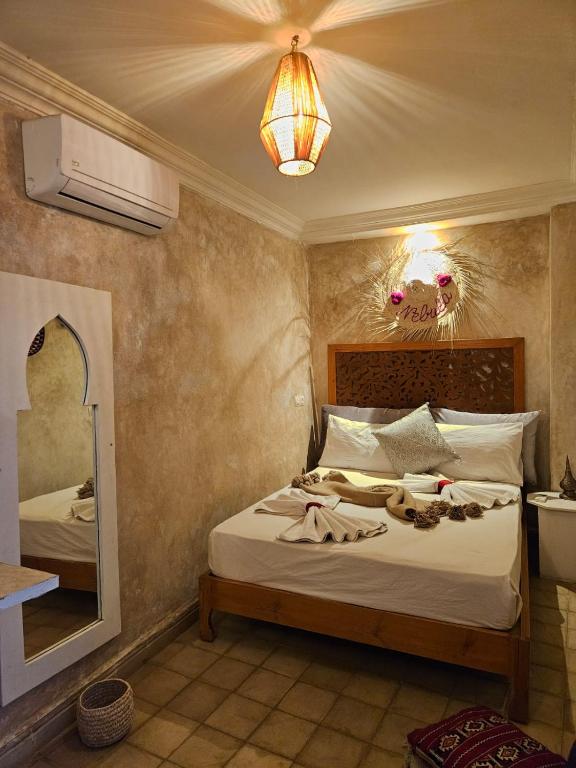 Postel nebo postele na pokoji v ubytování Riad Córdoba