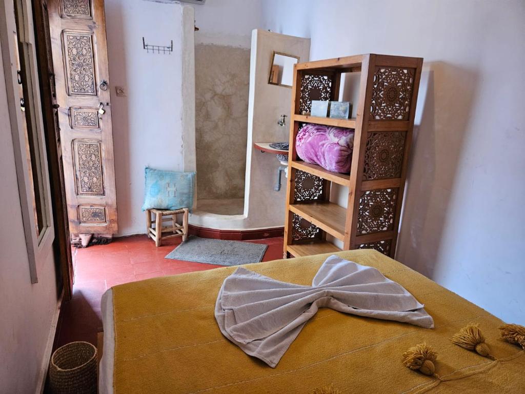 Postel nebo postele na pokoji v ubytování Riad Córdoba