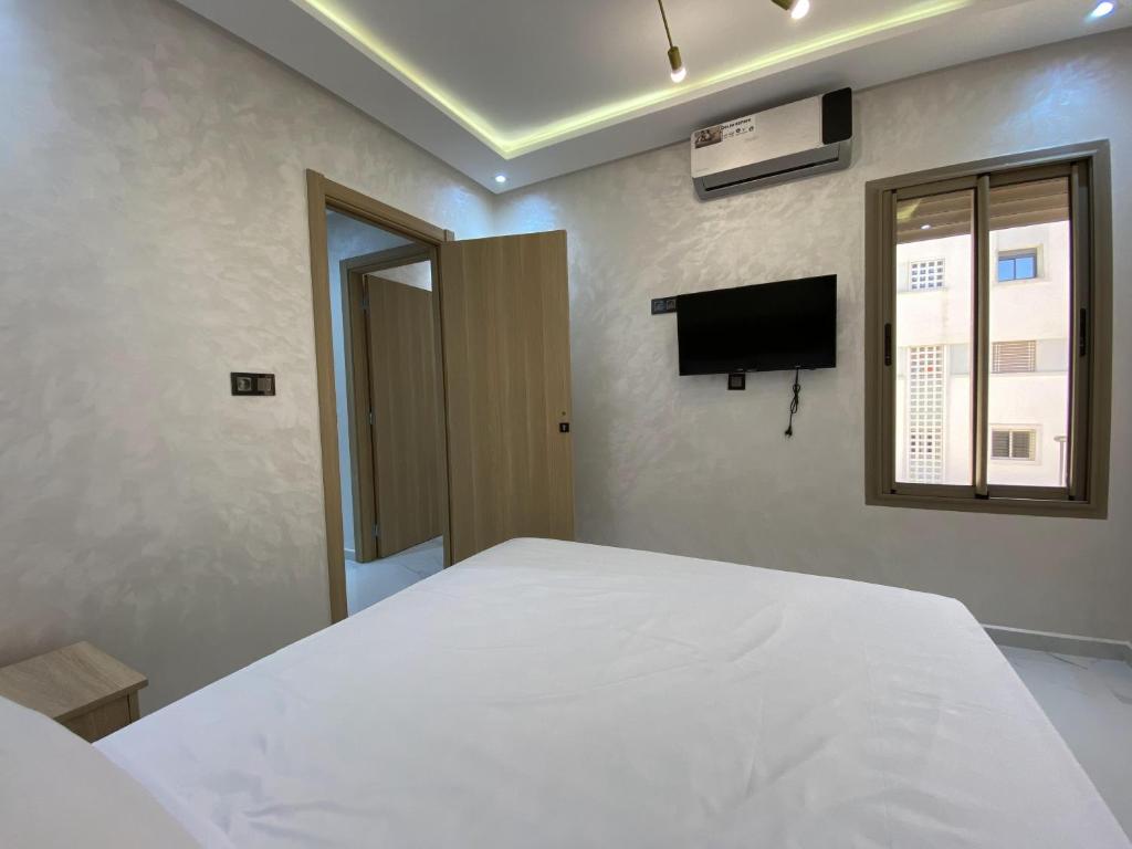 TV a/nebo společenská místnost v ubytování appartement bades alhoceima