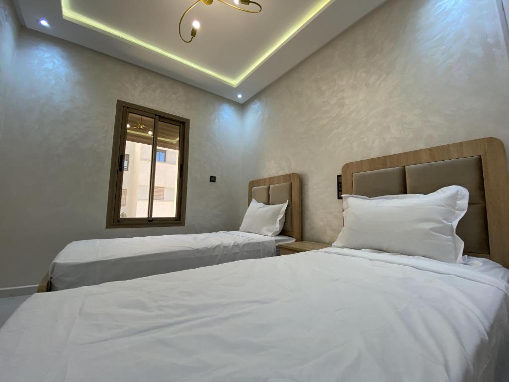 Postel nebo postele na pokoji v ubytování appartement bades alhoceima