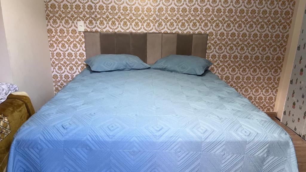 Postel nebo postele na pokoji v ubytování Quarto Aconchegante N 2