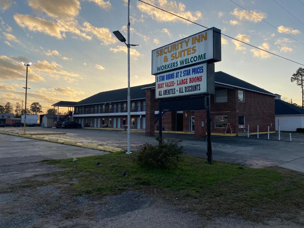 an empty parking lot with a sign in front of a building at Security Inn and Suites in Lake City