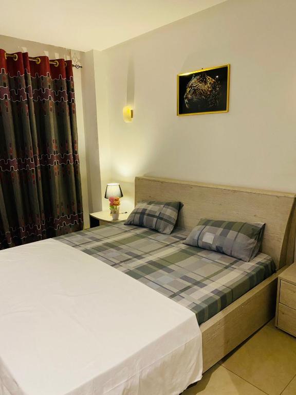 Llit o llits en una habitació de sonu guest house