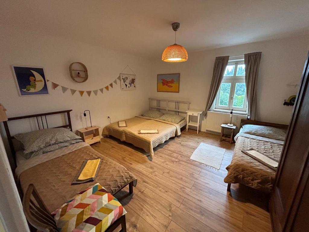 Postel nebo postele na pokoji v ubytování Apartmány Malý Princ