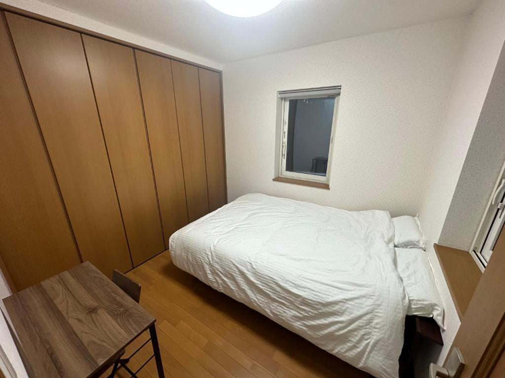 Postel nebo postele na pokoji v ubytování 康平宅
