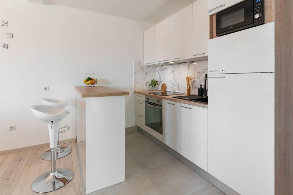 Kuchyň nebo kuchyňský kout v ubytování Apartments Lux 2