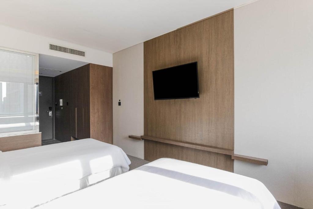Postel nebo postele na pokoji v ubytování Hotel Elora