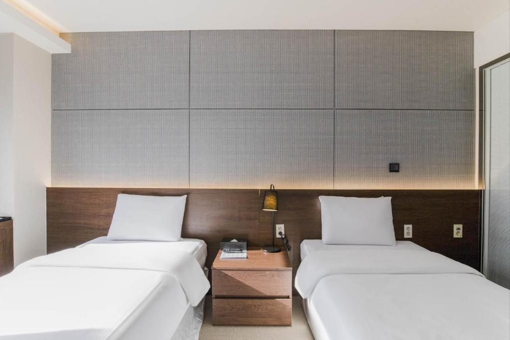 Postel nebo postele na pokoji v ubytování Hotel Elora