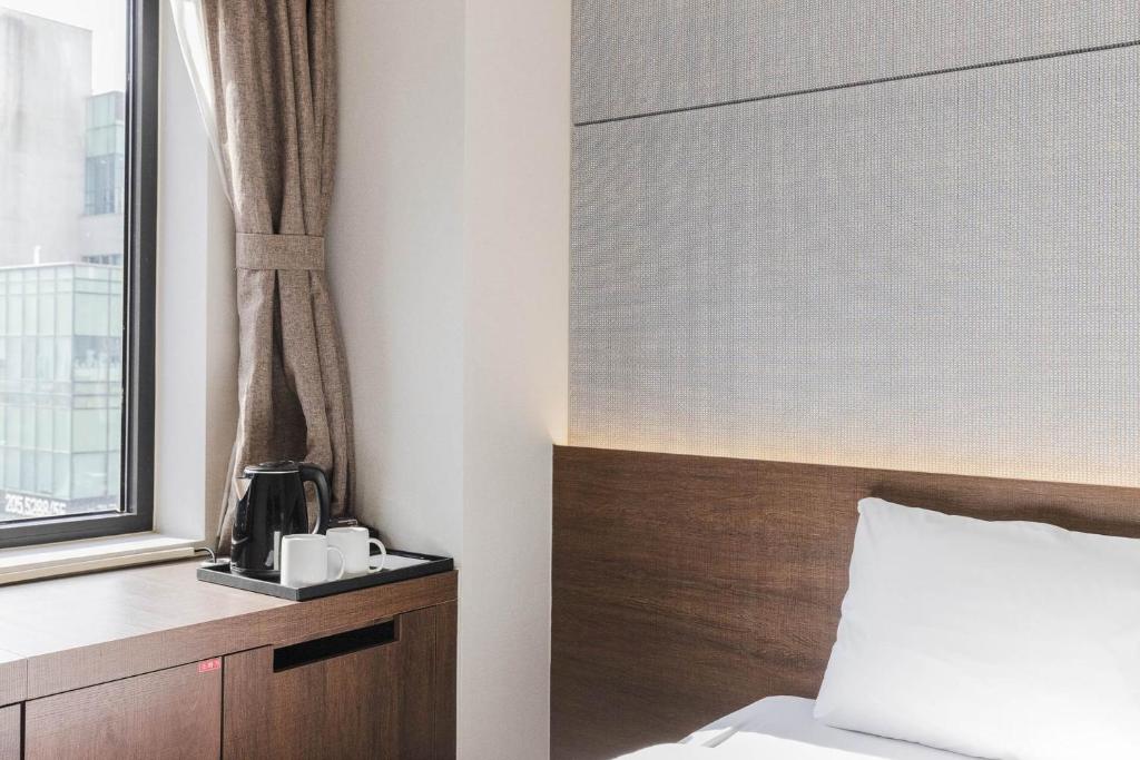 Postel nebo postele na pokoji v ubytování Hotel Elora
