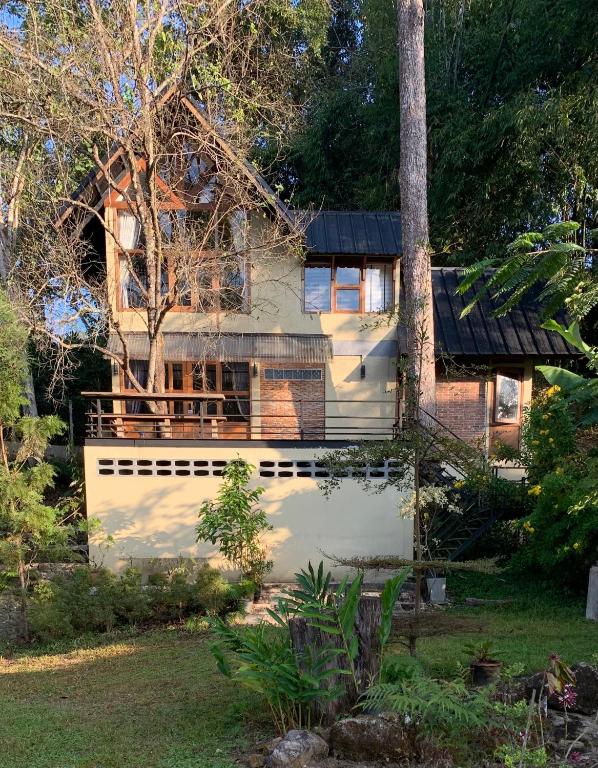 a house with a black roof at Aan cafe&stay in Chiang Mai