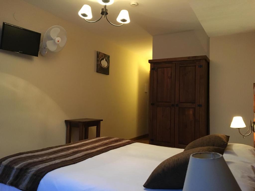 Postel nebo postele na pokoji v ubytování Hostal Otsoa