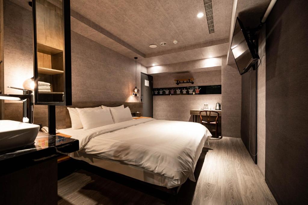 Postel nebo postele na pokoji v ubytování Huwei Hotel