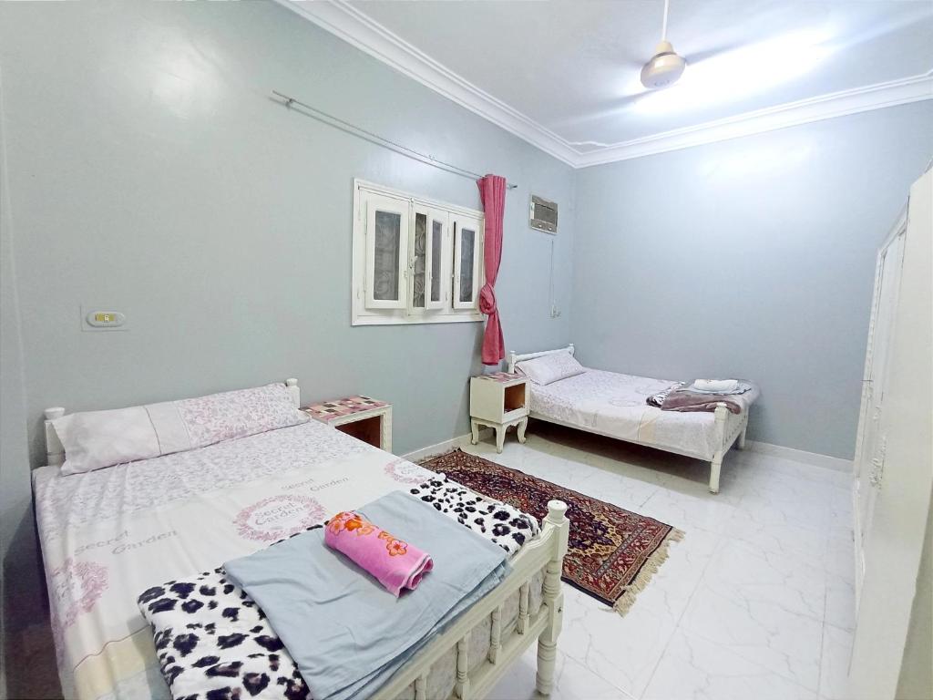 Postel nebo postele na pokoji v ubytování Winji Guest house