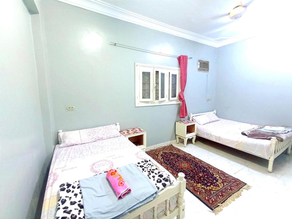 Postel nebo postele na pokoji v ubytování Winji Guest house