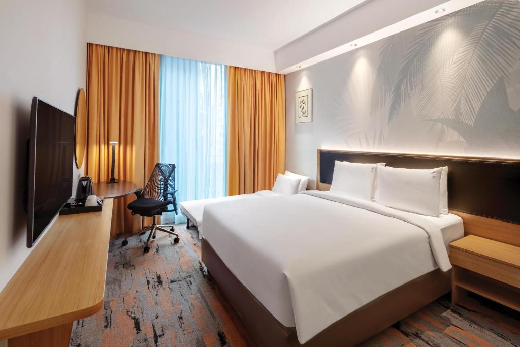 TV/trung tâm giải trí tại Holiday Inn Express Singapore Orchard Road by IHG
