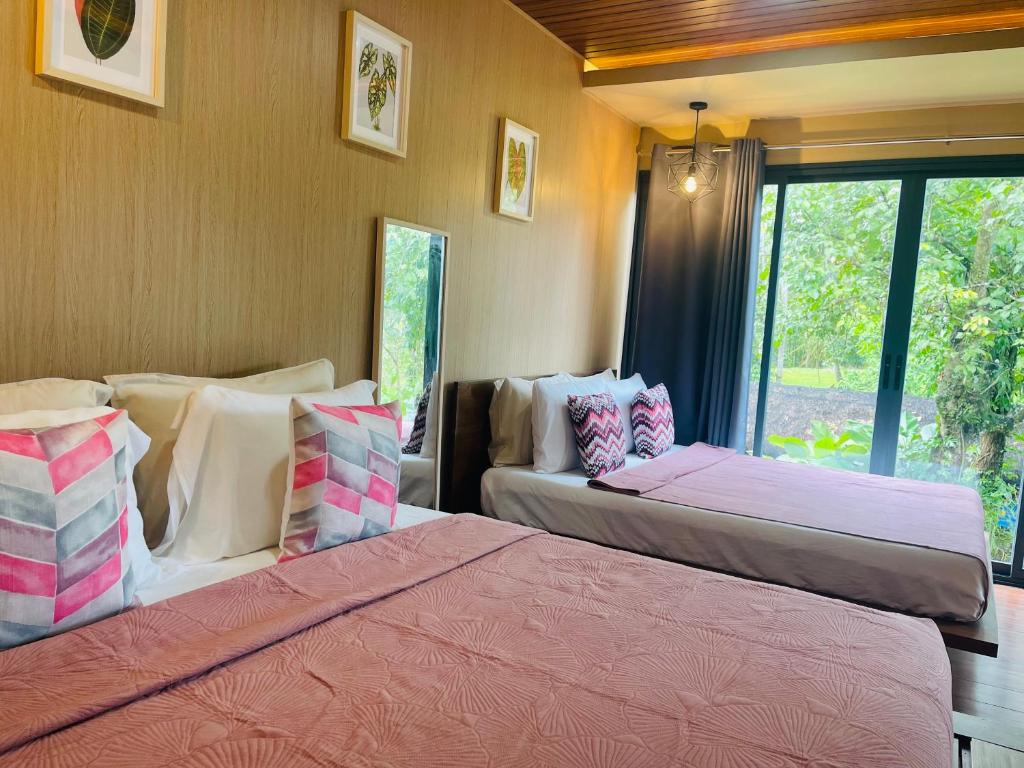 Postel nebo postele na pokoji v ubytování Jinjer Resort