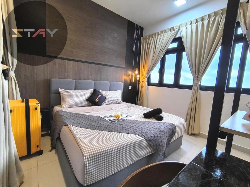 a bedroom with two beds and a large window at Meridin Sovo 1Bed Healing Space Netflix By STAY in Iskandar Puteri