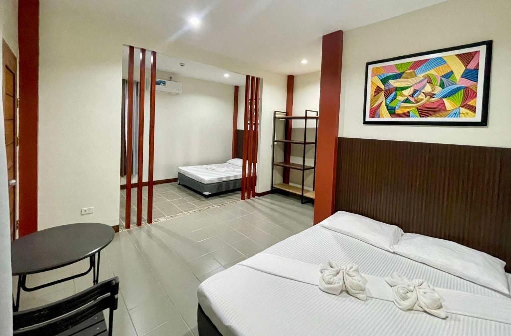 Postel nebo postele na pokoji v ubytování EL SUEÑO RESORT