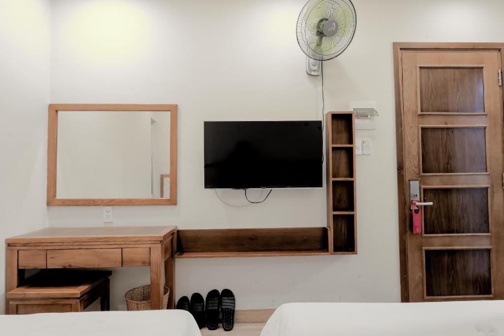 TV a/nebo společenská místnost v ubytování DaNa Sailing Hotel