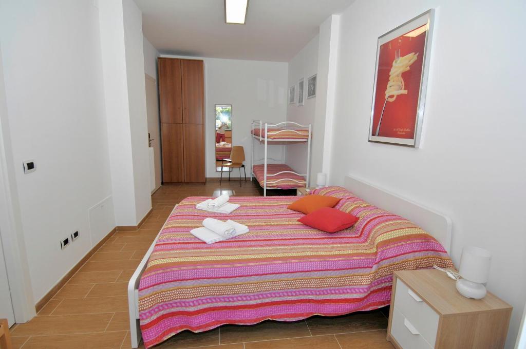 A bed or beds in a room at B&B Nonna Roma