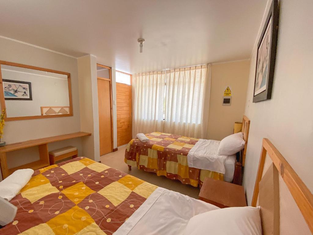 Postel nebo postele na pokoji v ubytování Hospedaje Dulce Estancia