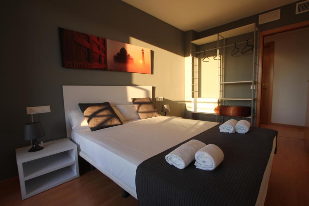 Posteľ alebo postele v izbe v ubytovaní For a Stay Las Dunas