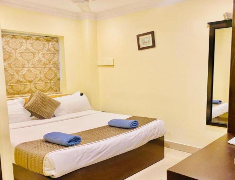 Postel nebo postele na pokoji v ubytování Hotel The Rio, Haridwar