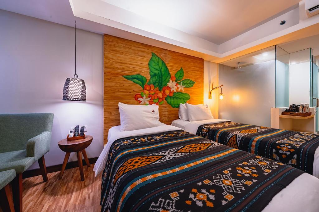 Postel nebo postele na pokoji v ubytování MaxOneHotels at Ubud - CHSE Certified