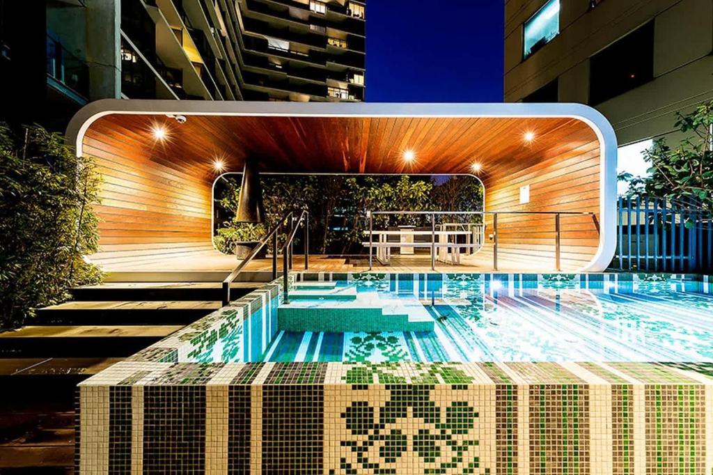 a swimming pool in the middle of a building at VAQUAY Bronte In Southbank in Melbourne