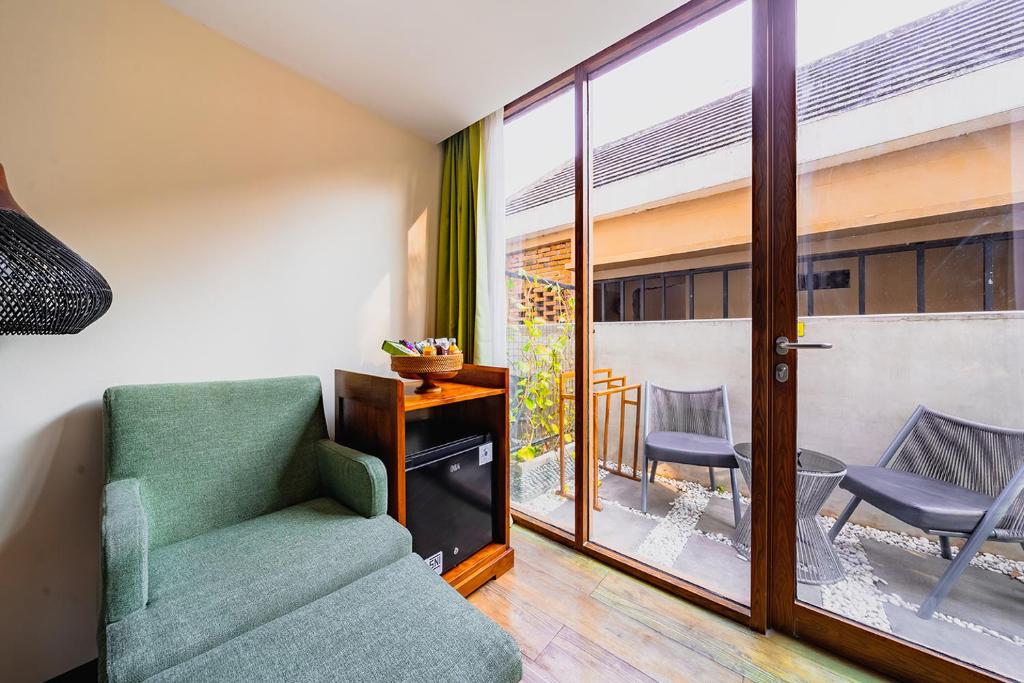 Posezení v ubytování MaxOneHotels at Ubud - CHSE Certified