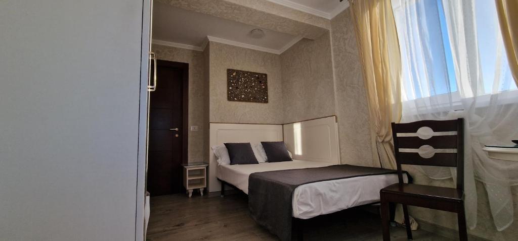 Postel nebo postele na pokoji v ubytování Florian Rooms