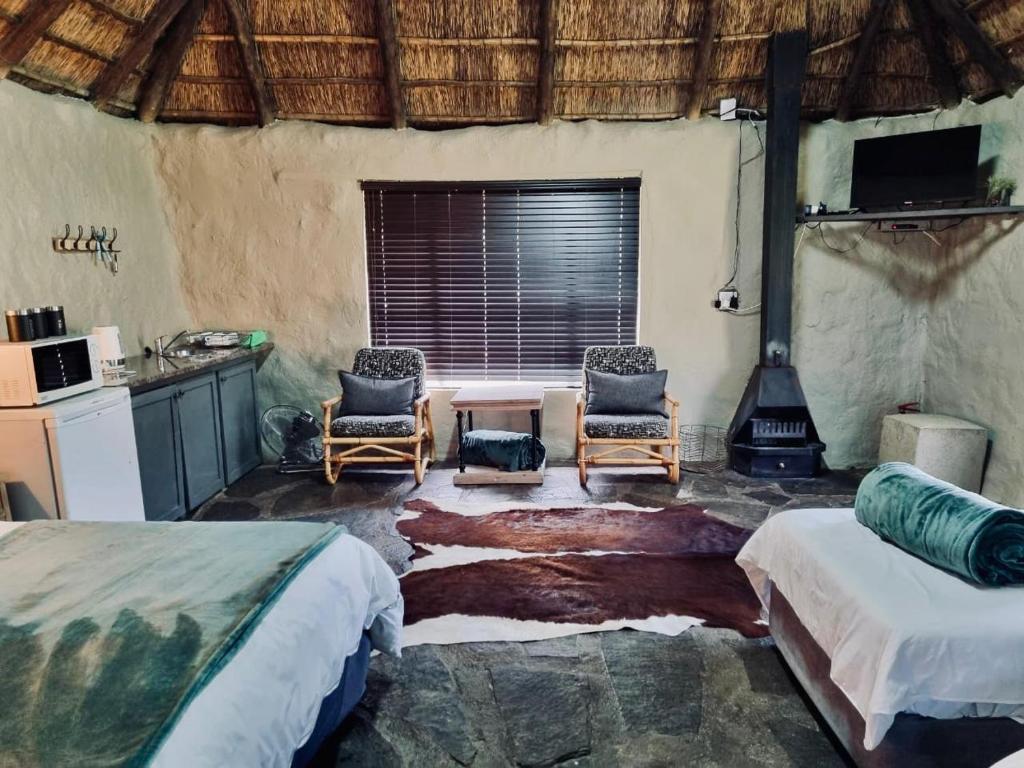 Postel nebo postele na pokoji v ubytování Safari Park Guest Farm